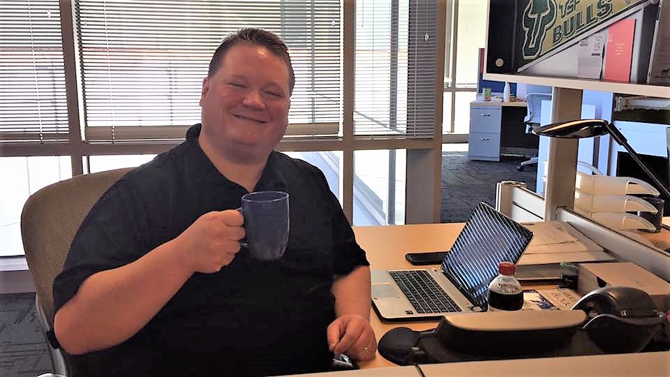 Robert Sean Pascoe in office with coffee (as always)