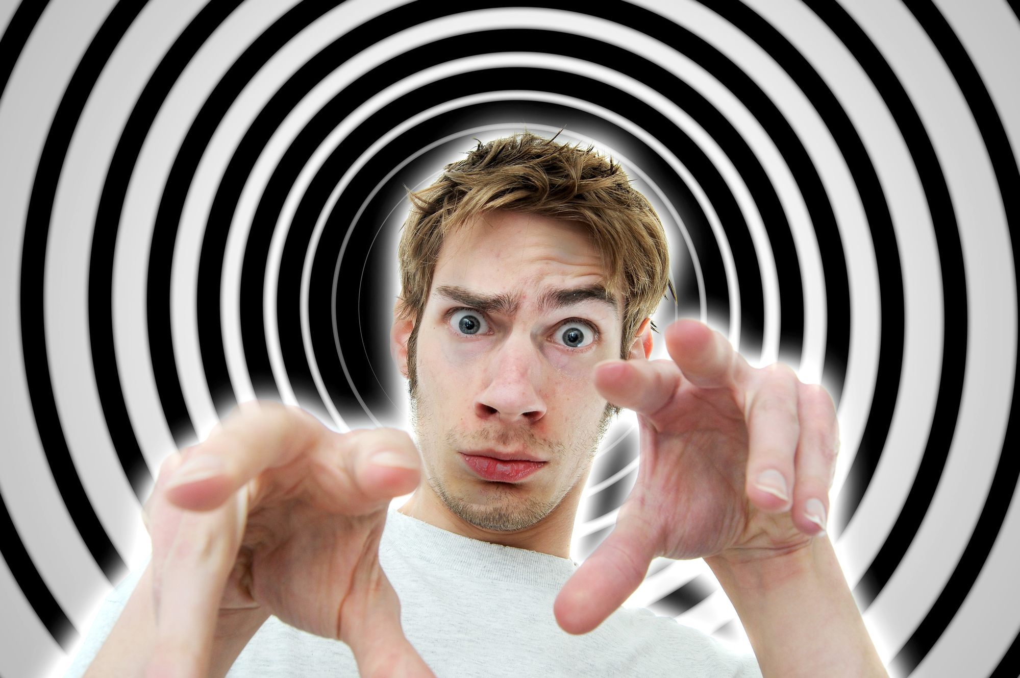 Image of a hypnotist brainwashing the viewer into a deep subconscious subliminal trance using secret mind control tactics.